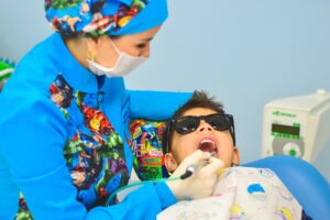 A child visiting a pediatric dental nurse.