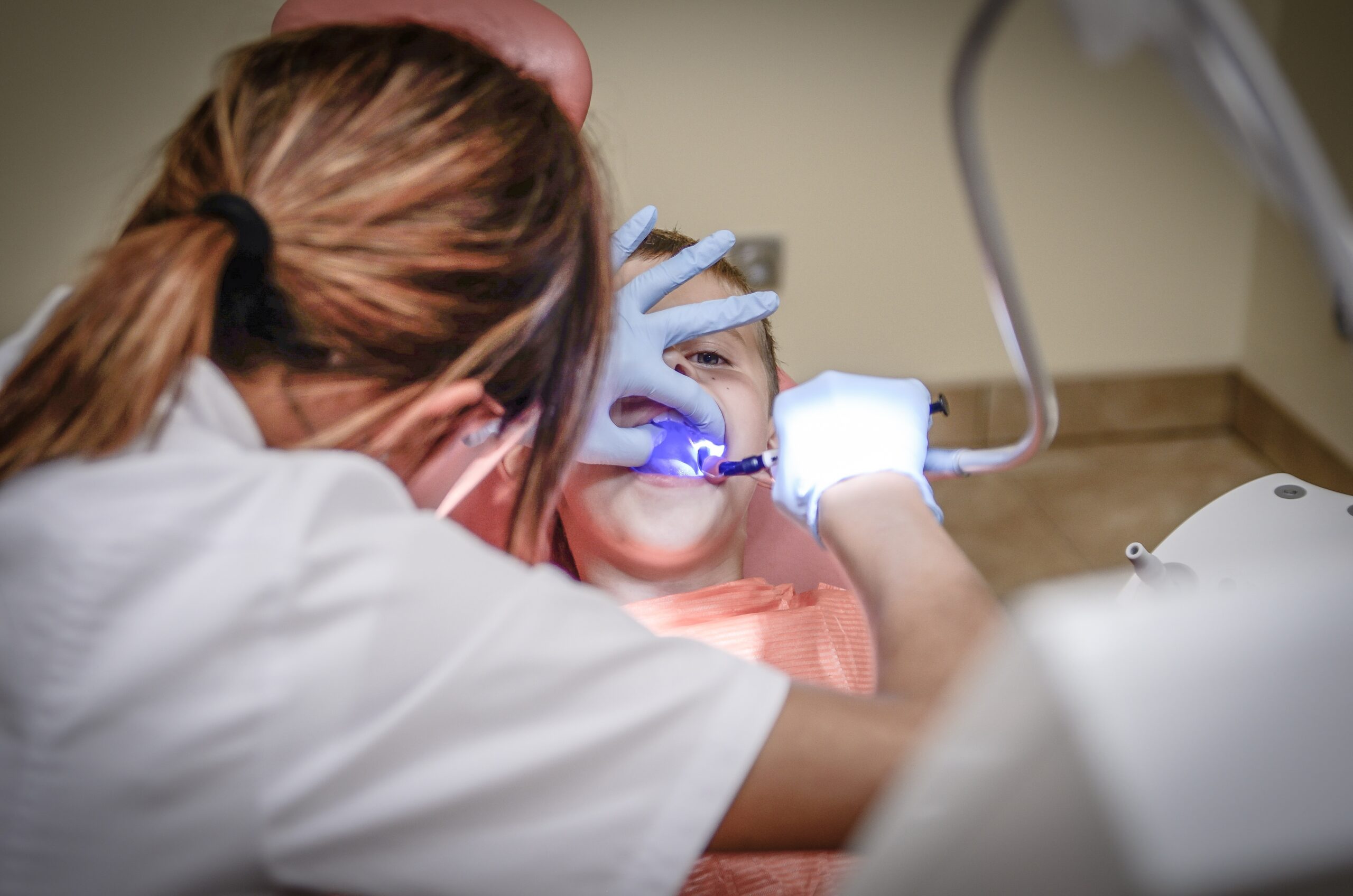 A pediatric dentist with their patient.